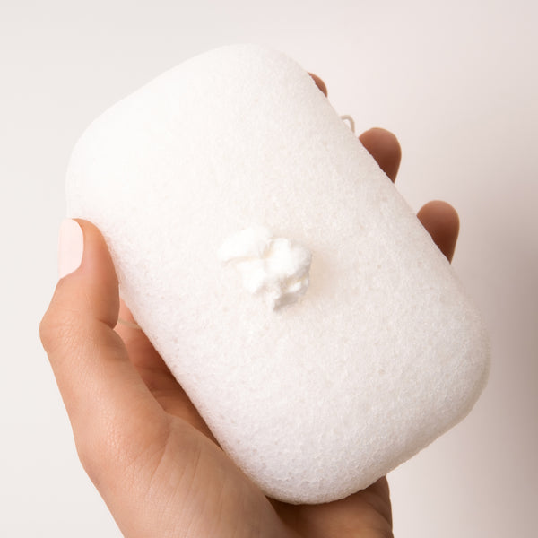 Slide tube key over top of tube and roll down gently to dispense a 1-inch strip of the concentrate paste onto palm or our konjac sponge.